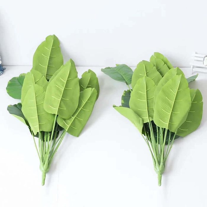 Real Touch Artificial Monstera Plant with lifelike leaves displayed on a table, ideal for home decor.