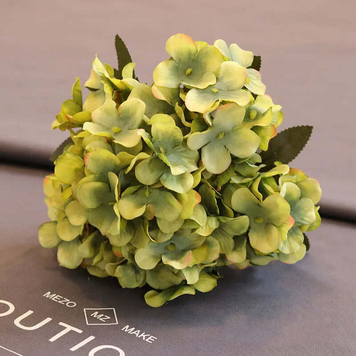 Artificial hydrangea floral bunch in green hues, ideal for wedding and home decoration.