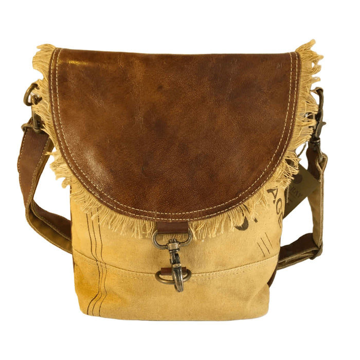 Eco-friendly canvas leather flap closure shoulder bag with fringe detail and zippered back pocket.