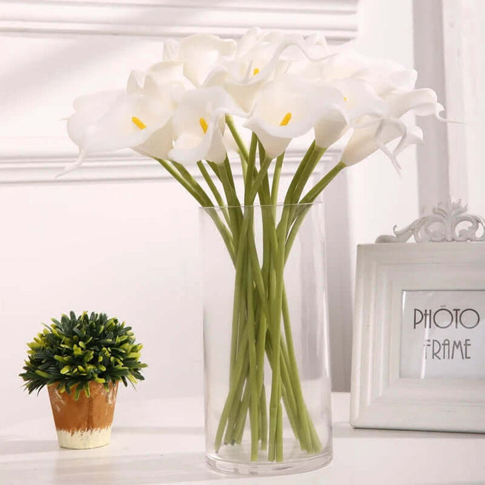 Real-touch calla lily artificial flowers in a clear vase, perfect for home decor and events. Elegant 10 pc bunch.