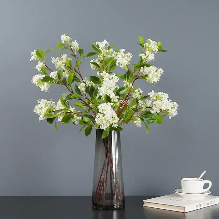 Artificial osmanthus tall stems arranged in a sleek vase, showcasing elegant floral design for home decor.