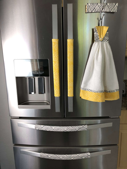 Grey Geometric to Yellow Reversible Appliance Handle Covers on fridge with matching towel.