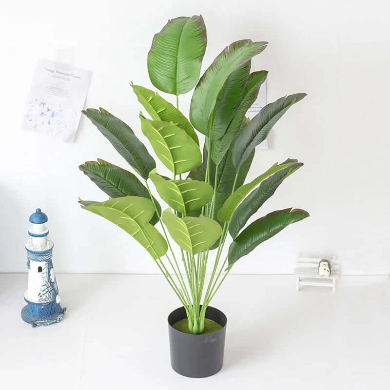 Real Touch Artificial Monstera Plant in a black pot with realistic green leaves, ideal for home or office decor.