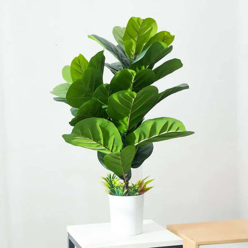 Artificial Monstera plants in a decorative pot, perfect for enhancing home decor with elegant tropical greenery.