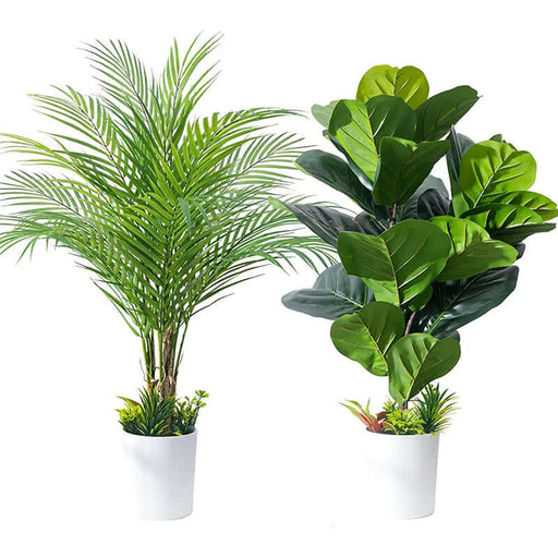Artificial monstera plants alongside a lush palm, enhancing home decor with realistic tropical greenery.