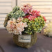 Artificial hydrangea floral bunch in a decorative basket, perfect for weddings and home decoration.