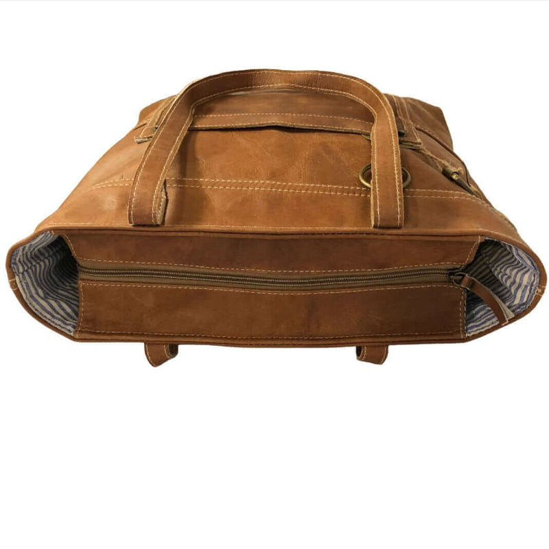 Brown leather shoulder tote bag showing its spacious interior and durable design.