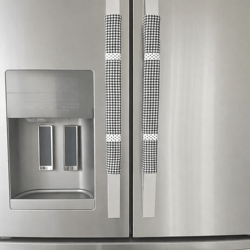 Stainless steel refrigerator with black and white checkered handle covers