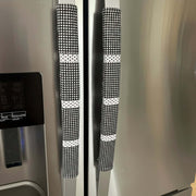 Stainless steel refrigerator with black and white checkered handle covers