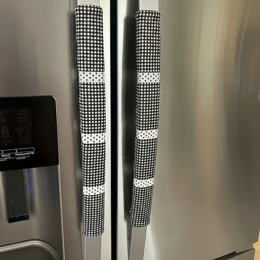 Stainless steel refrigerator with black and white checkered handle covers