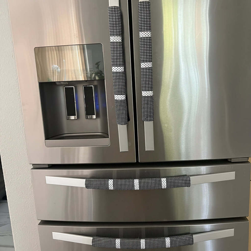 Stainless steel refrigerator with water and ice dispenser in a kitchen setting
