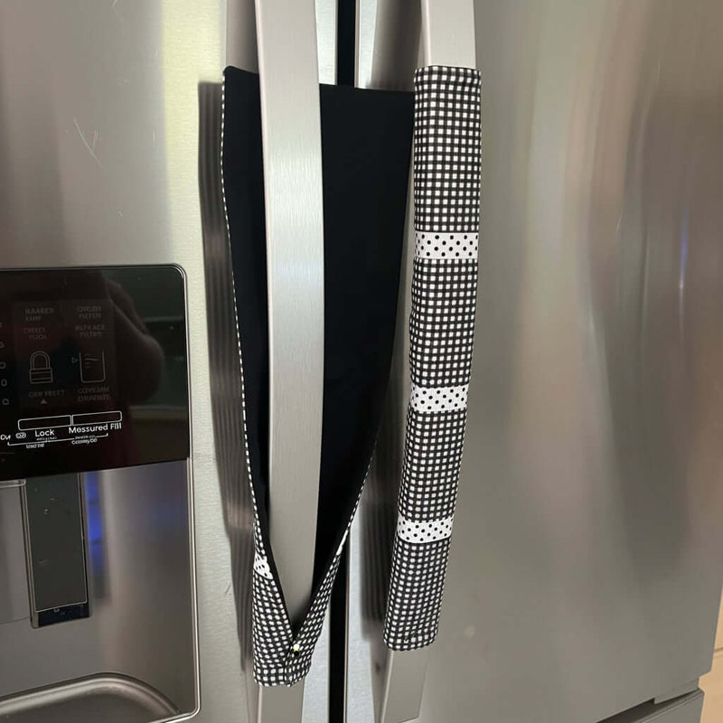 Stainless steel refrigerator with black and white checkered handles