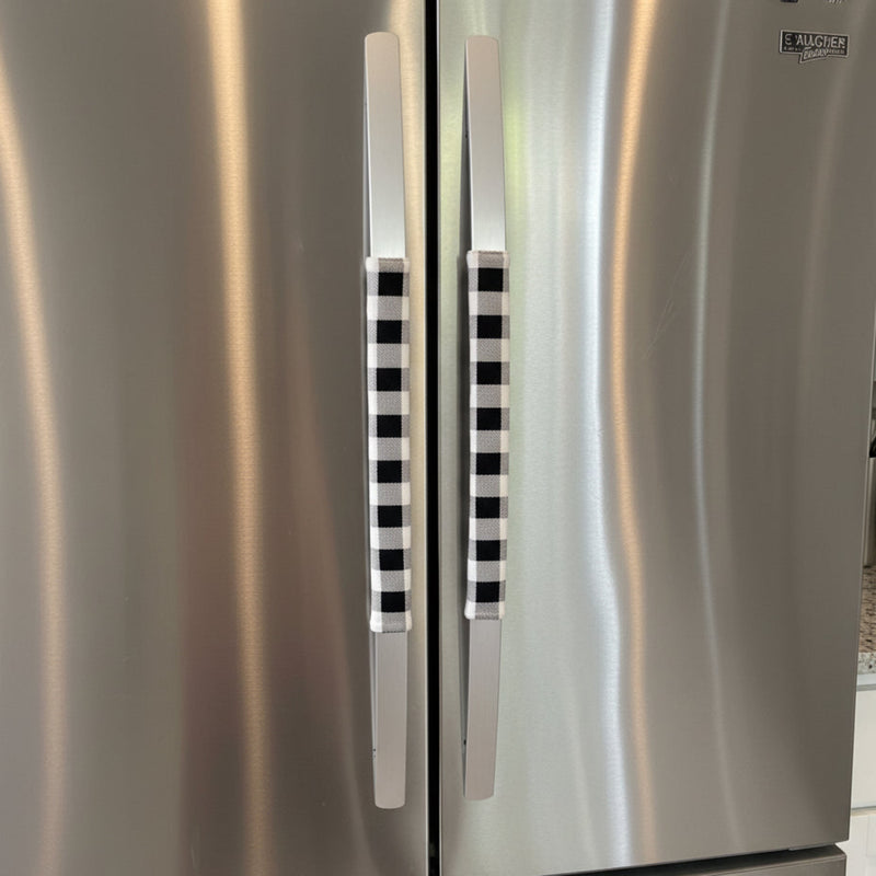 Stainless steel refrigerator with black and white checkered handles