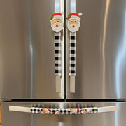 Stainless steel refrigerator with decorative Christmas-themed handles