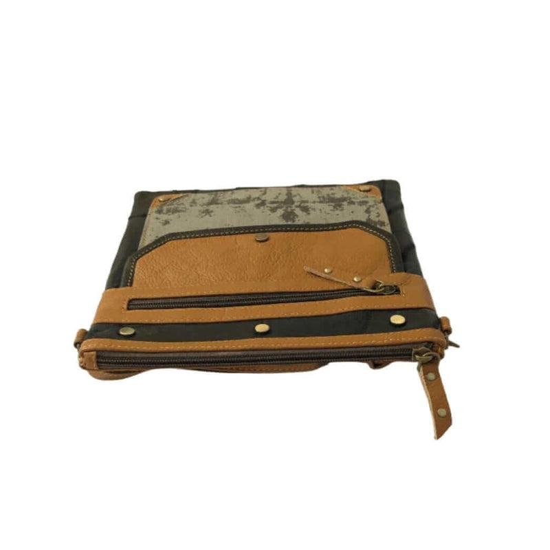 Canvas leather crossbody bag featuring sturdy construction and multiple pockets for organization.