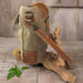 Canvas leather BIPLANE crossbody handbag in tan and khaki, showcased on a rustic wooden background.
