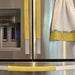 Stylish yellow handle covers on a modern refrigerator, adding a touch of color to kitchen decor.