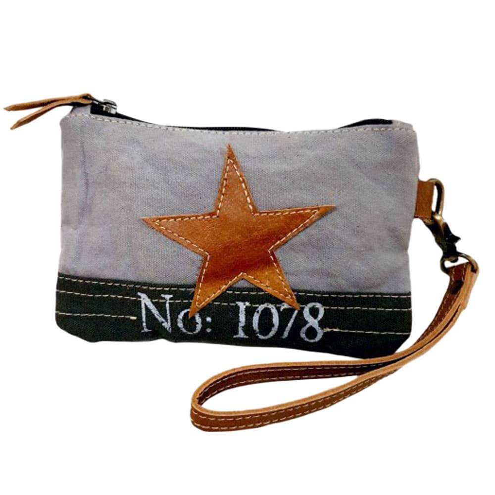 Eco-friendly canvas wristlet pouch with leather star detail and wrist strap, perfect for carrying essentials.