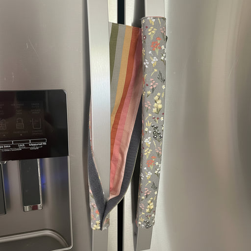 Decorative appliance handle cover on a refrigerator handle showing stripe flip side. 