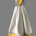 Handmade geometric kitchen hand towel in white and yellow with stylish patterns and convenient hanging loop.