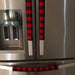 Red and black buffalo check appliance handle covers on a refrigerator, adding rustic farmhouse style and protection.