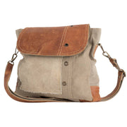 Eco-friendly khaki shoulder bag with tan leather flap, made from upcycled materials, perfect for everyday use.