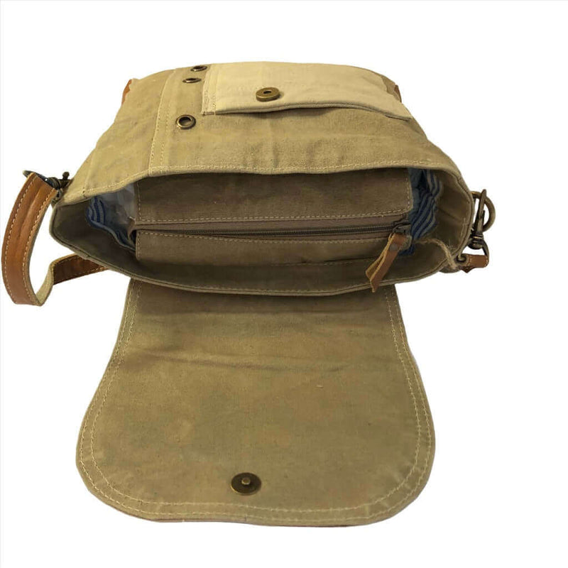 Eco-friendly khaki shoulder bag open to showcase adjustable straps and functional interior pockets.
