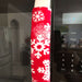 Snowflake design appliance handle cover on a microwave, adding a festive winter touch to the kitchen.