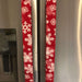 Festive winter snowflakes appliance handle covers on a kitchen refrigerator, adding holiday charm and style.