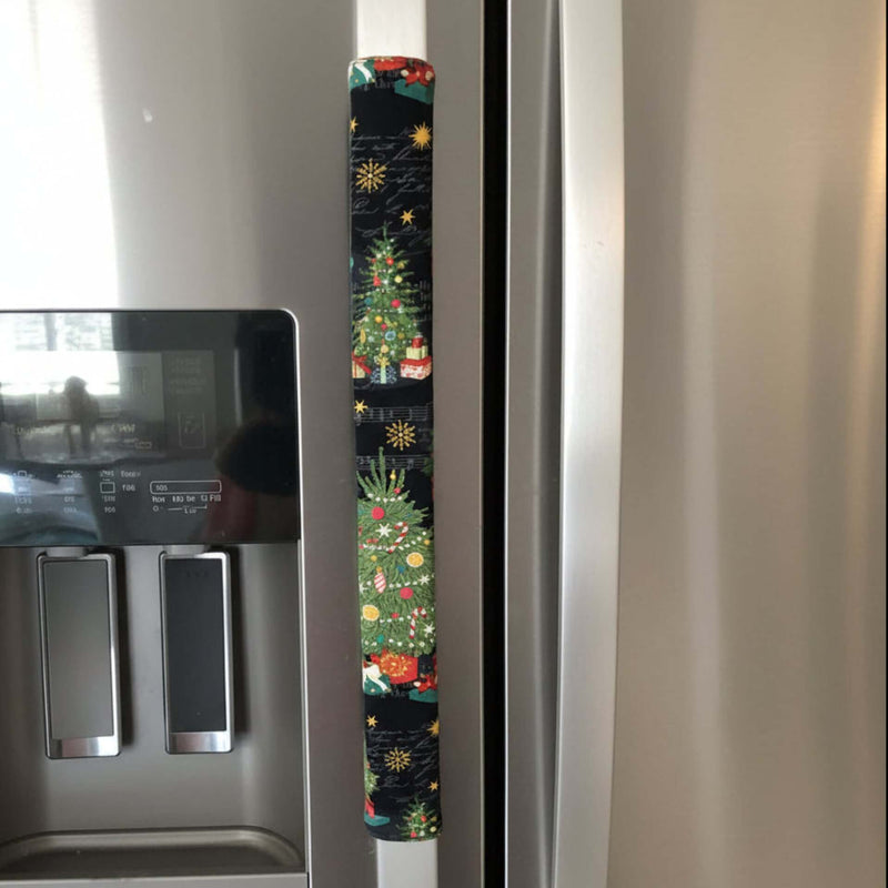 Decorative Christmas tree design handle cover on a refrigerator door.