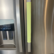Mint Green textured handle cover on a stainless steel refrigerator door.
