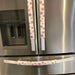 Rose pink snowflake appliance handle covers on a stainless steel refrigerator, adding festive decor for Christmas.