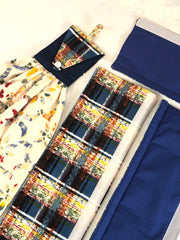 Plaid fabric handle covers with a matching towel in a box with a blue cover