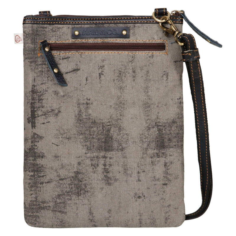 Repurposed canvas crossbody bag with leather accents and zipper pocket for added style and functionality.