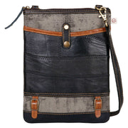 Repurposed canvas crossbody bag featuring a stylish design with leather and canvas materials.