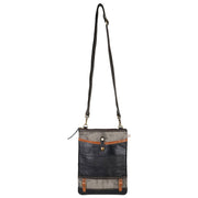Repurposed canvas crossbody bag featuring leather accents and adjustable strap, ideal for stylish and sustainable fashion.