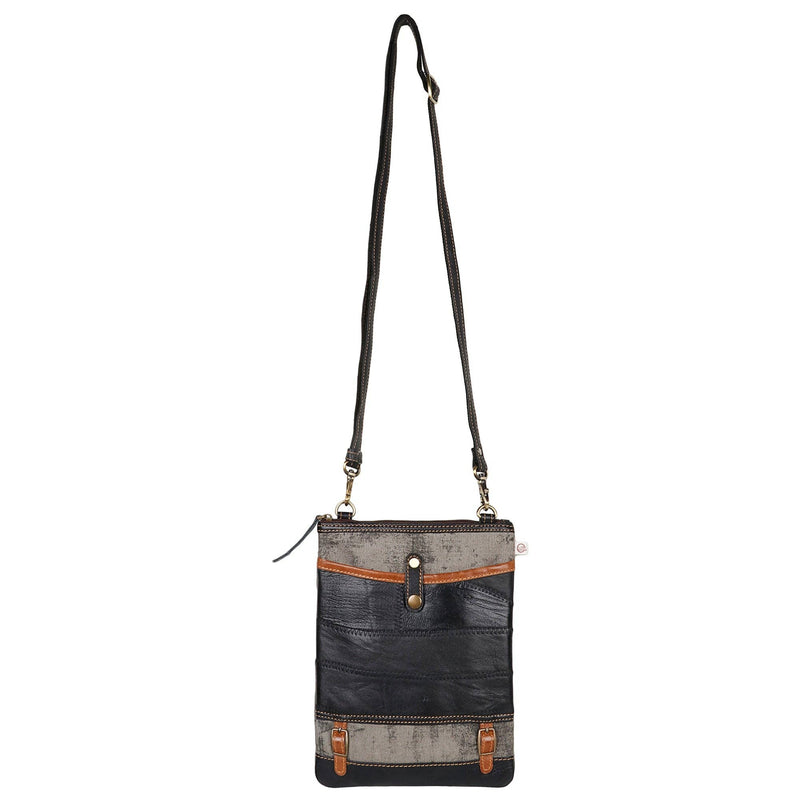 Repurposed canvas crossbody bag featuring leather accents and adjustable strap, ideal for stylish and sustainable fashion.