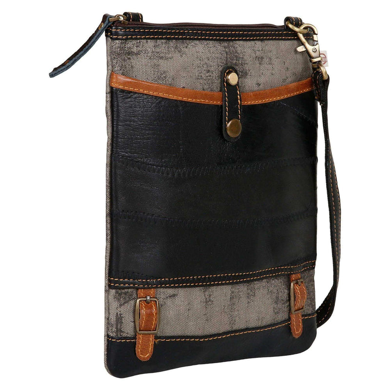 Repurposed canvas crossbody bag featuring sturdy leather accents and a zipper-top design for style and functionality.