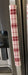 Gnomes on The Green Christmas Appliance Handle Covers in red and white plaid design on a refrigerator handle.