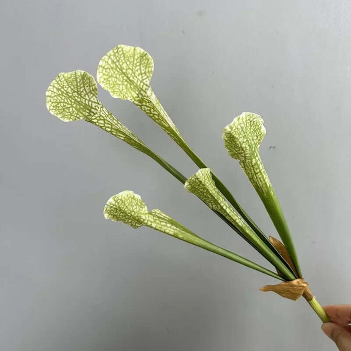 Realistic simulation nepenthes artificial plant with green and white flowers, perfect for home or office decor.
