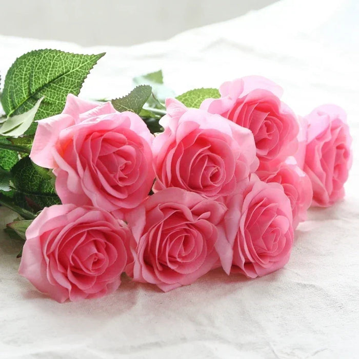 Latex real-touch artificial rose stem with vibrant pink blooms and lush green leaves, perfect for decor.