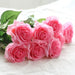 Latex real-touch artificial rose stem with vibrant pink blooms and lush green leaves, perfect for decor.