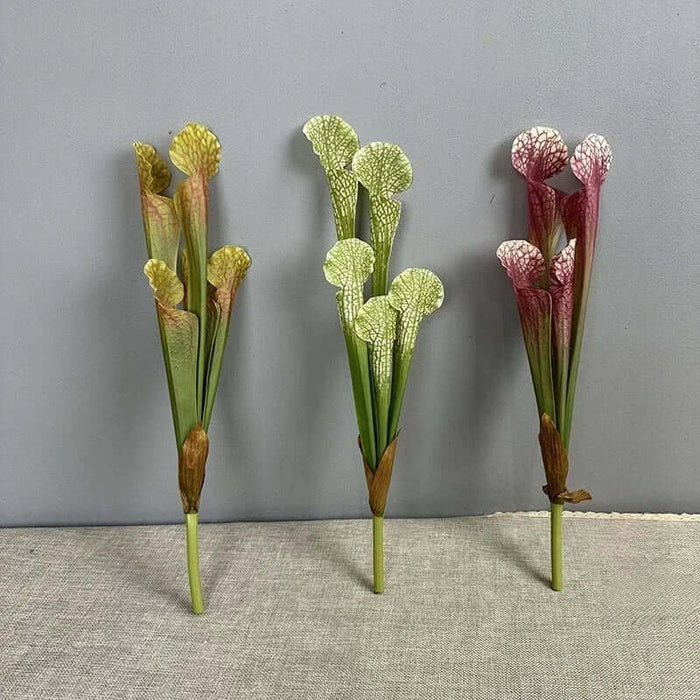 Three realistic simulation nepenthes artificial plants in green and red, perfect for home decor or floral arrangements.