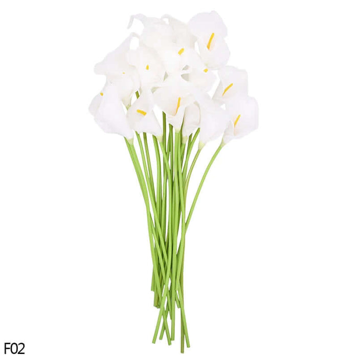 Bunch of 10 all white real-touch calla lily artificial flowers on green stems for home decor and events.