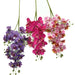 Colorful artificial phalaenopsis orchid stems in purple, pink, and fuchsia, showcasing realistic flower heads.