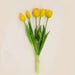 Soft silicone artificial tulip bouquet featuring vibrant yellow tulips and green leaves, perfect for home decor or events.