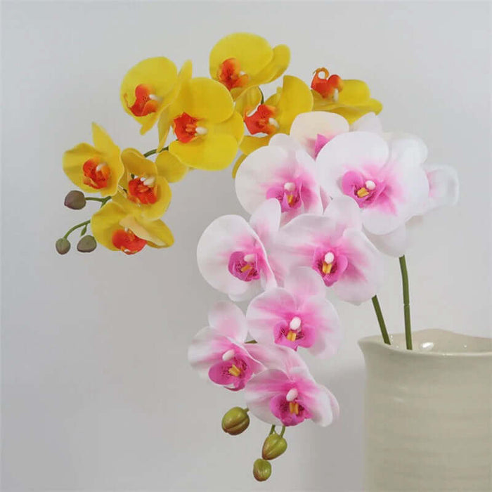 Artificial Moth Butterfly Orchid in pink and yellow colors, showcasing realistic touch flowers in a vase for home decor.