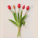 Soft silicone artificial tulip bouquet with red flowers and green leaves, perfect for home decor and special occasions.