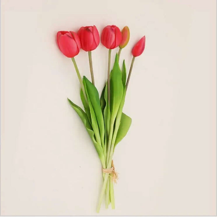 Soft silicone artificial tulip bouquet with vibrant red flowers and green leaves, perfect for home decor and events.