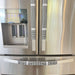 Black and white buffalo plaid appliance handle covers on refrigerator handles, enhancing kitchen decor and preventing stains.